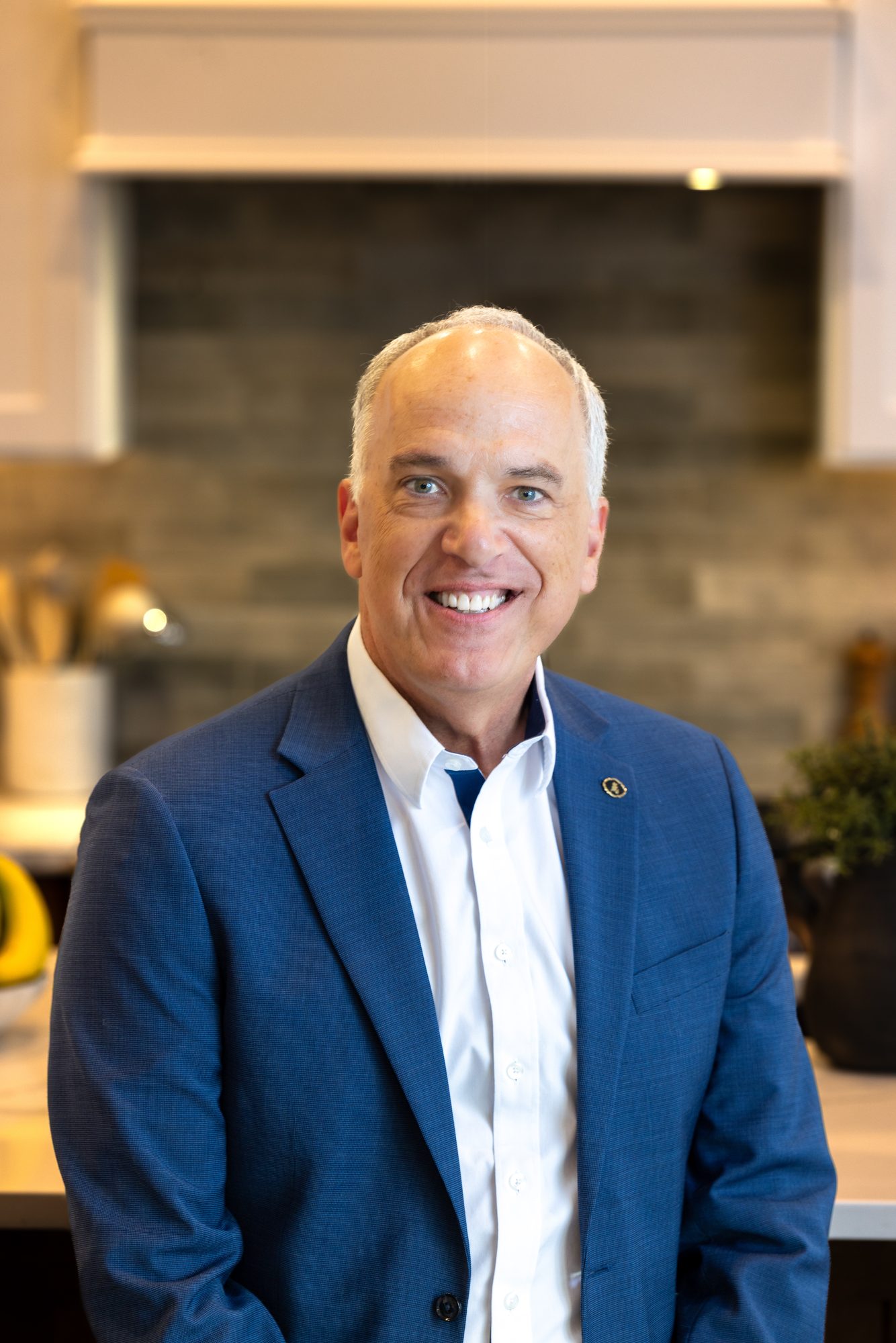 Real estate agent headshot of Scott Lewis in a modern kitchen setting, close crop, Ashland Oregon business photographer